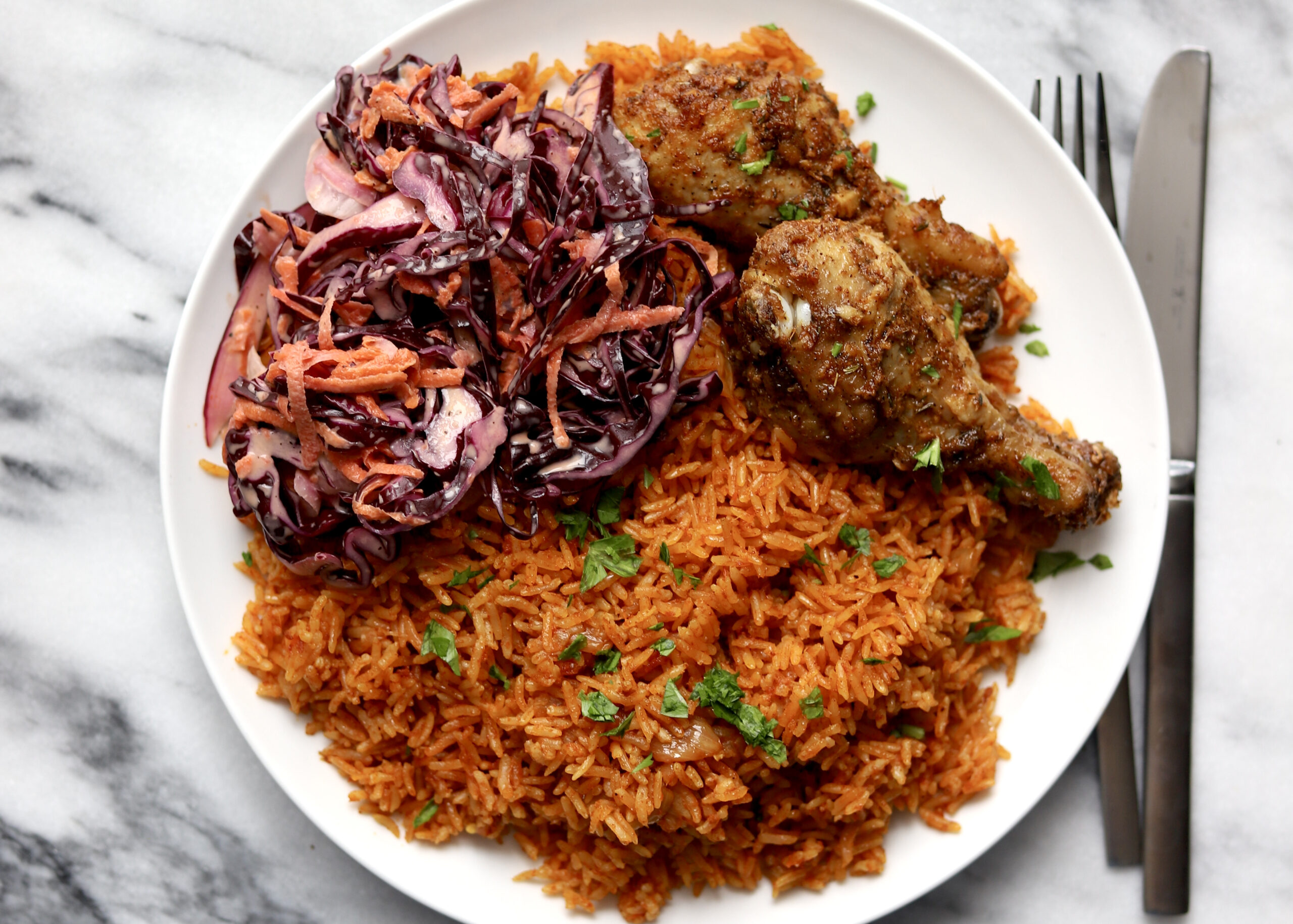 Jollof Rice and Chicken with Coleslaw - Travelandmunchies